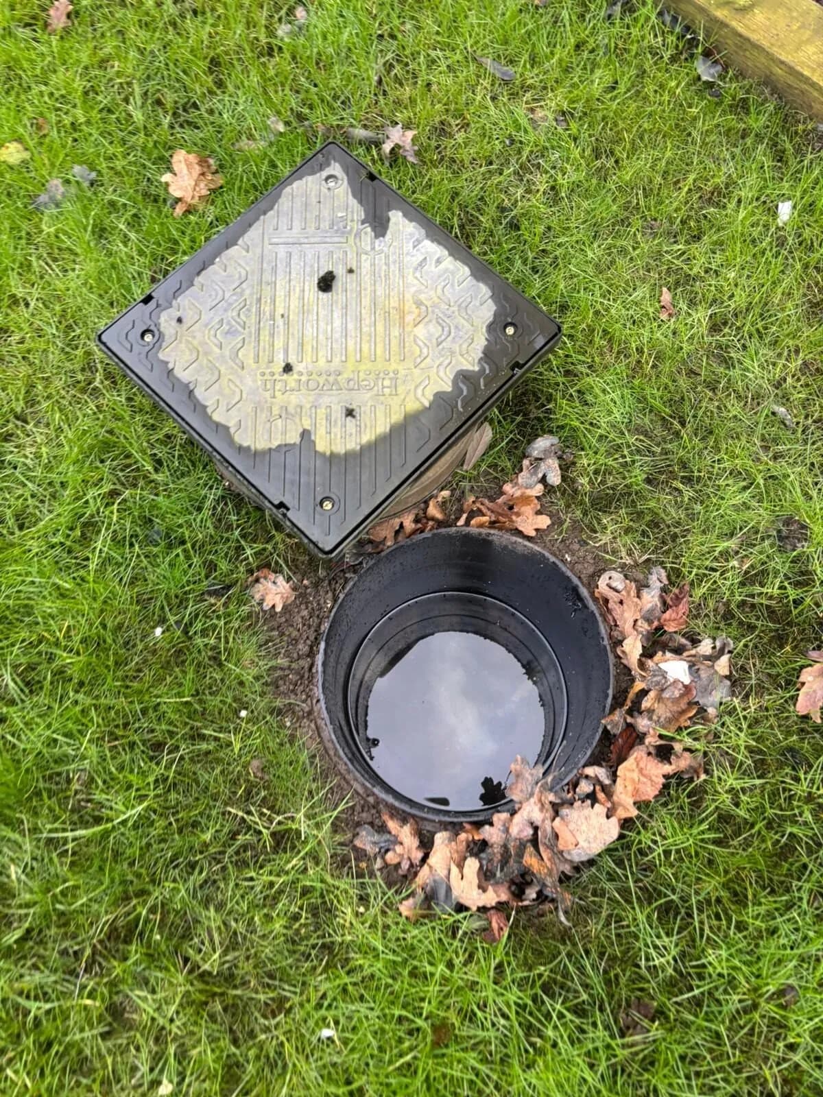 Open drainage inspection chamber being assessed during a Just Drainage call-out